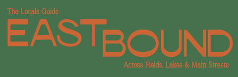 The Locals Guide Eastbound logo in orange text on green background with tagline Across Fields, Lakes and Main Streets